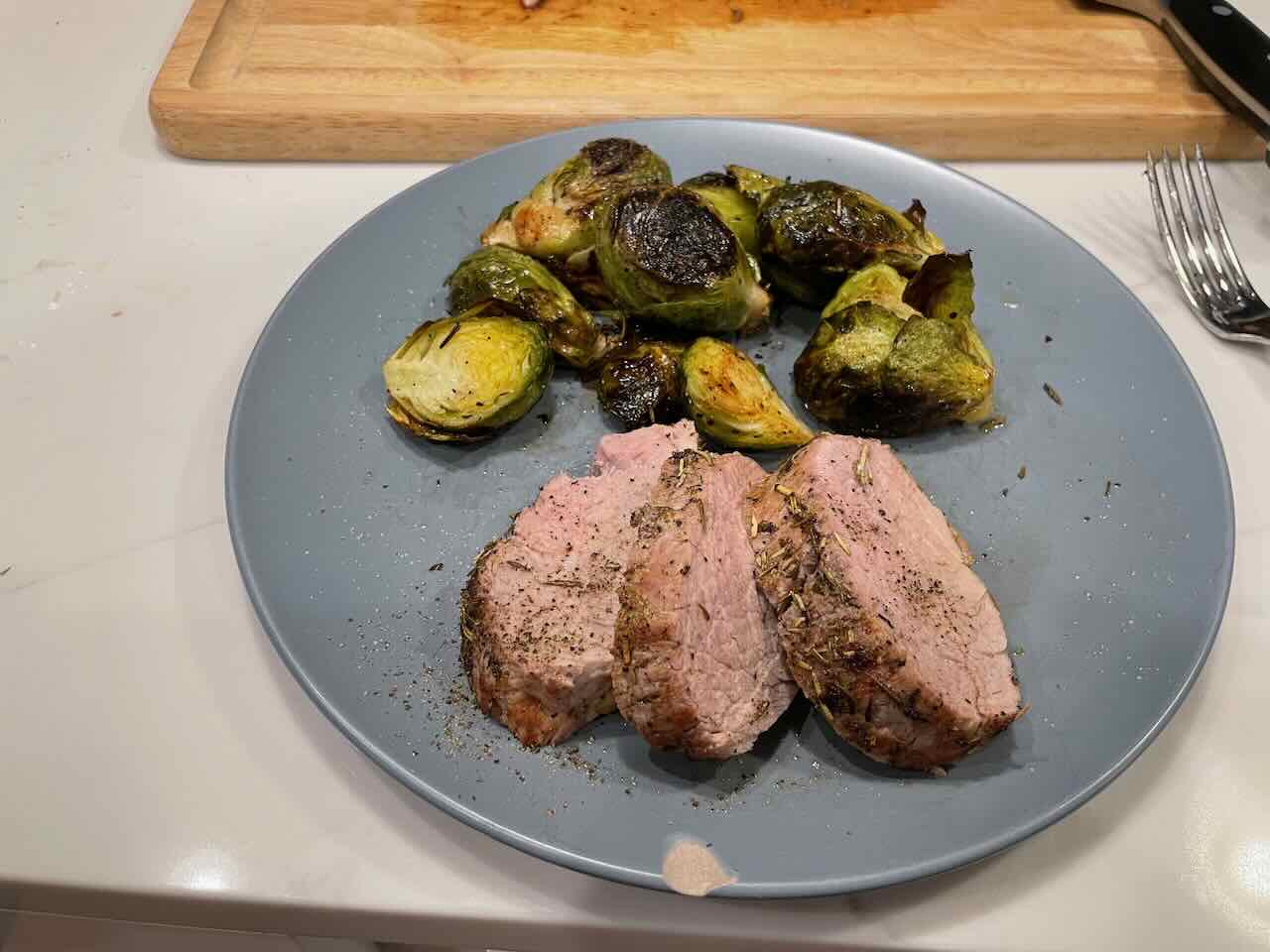 Tenderloin medallions and sprouts, plated.